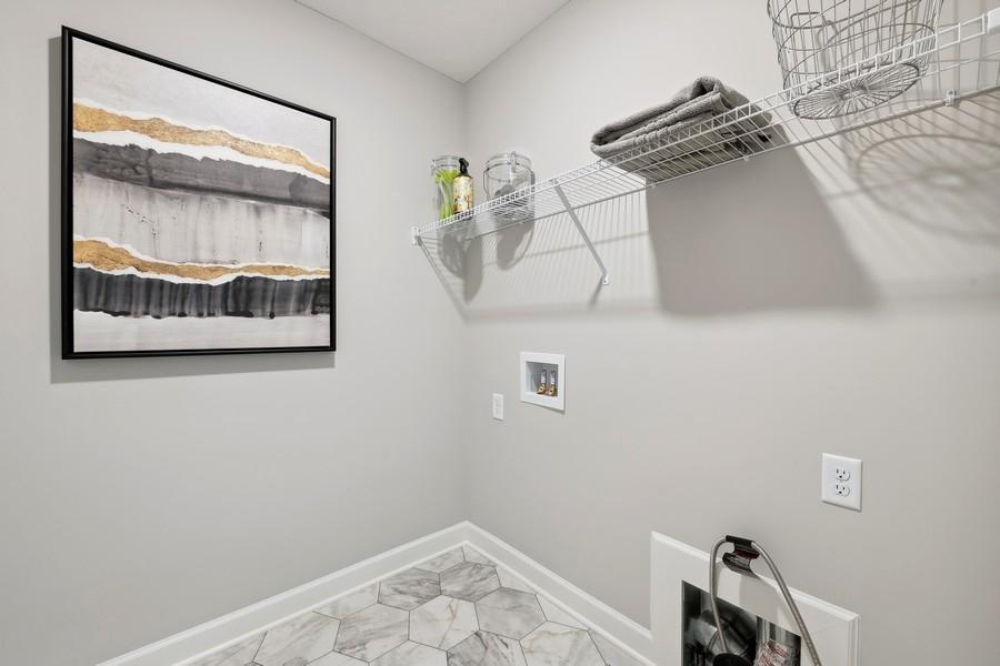 (Photo of a decorated model, actual features will vary) Centrally located on the upper level, along with the three bedrooms, this laundry room provides the ultimate convenience.