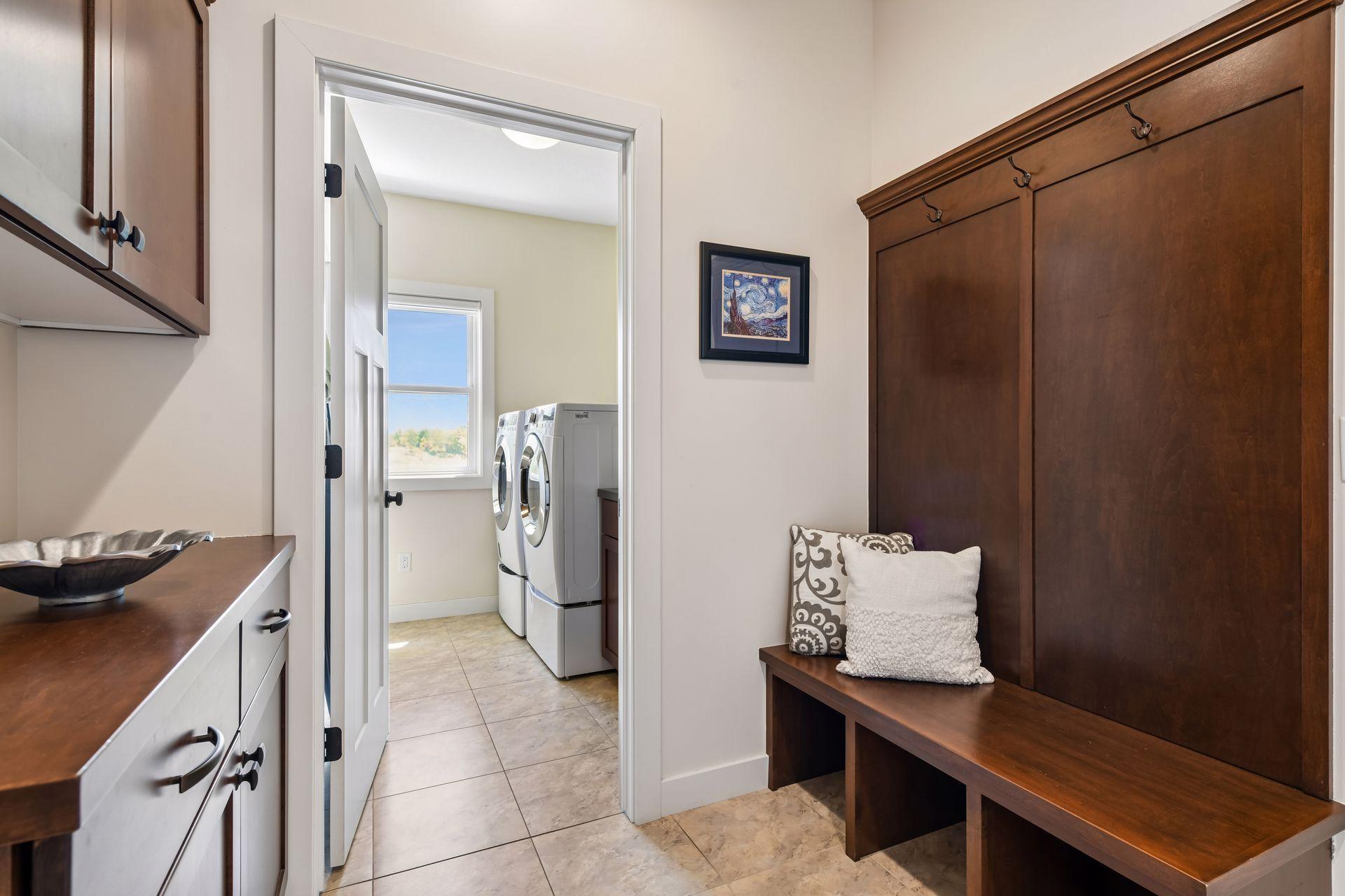 A well-appointed mud room greets you as you enter from the garage. A very large walk-in closet (not shown) is located where the photographer is standing.