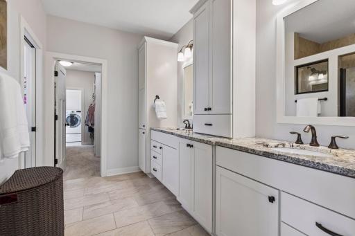 The homeowner's bathroom en suite has a large walk-in tile shower to the left as well as an enclosed space for the commode (neither are shown here).