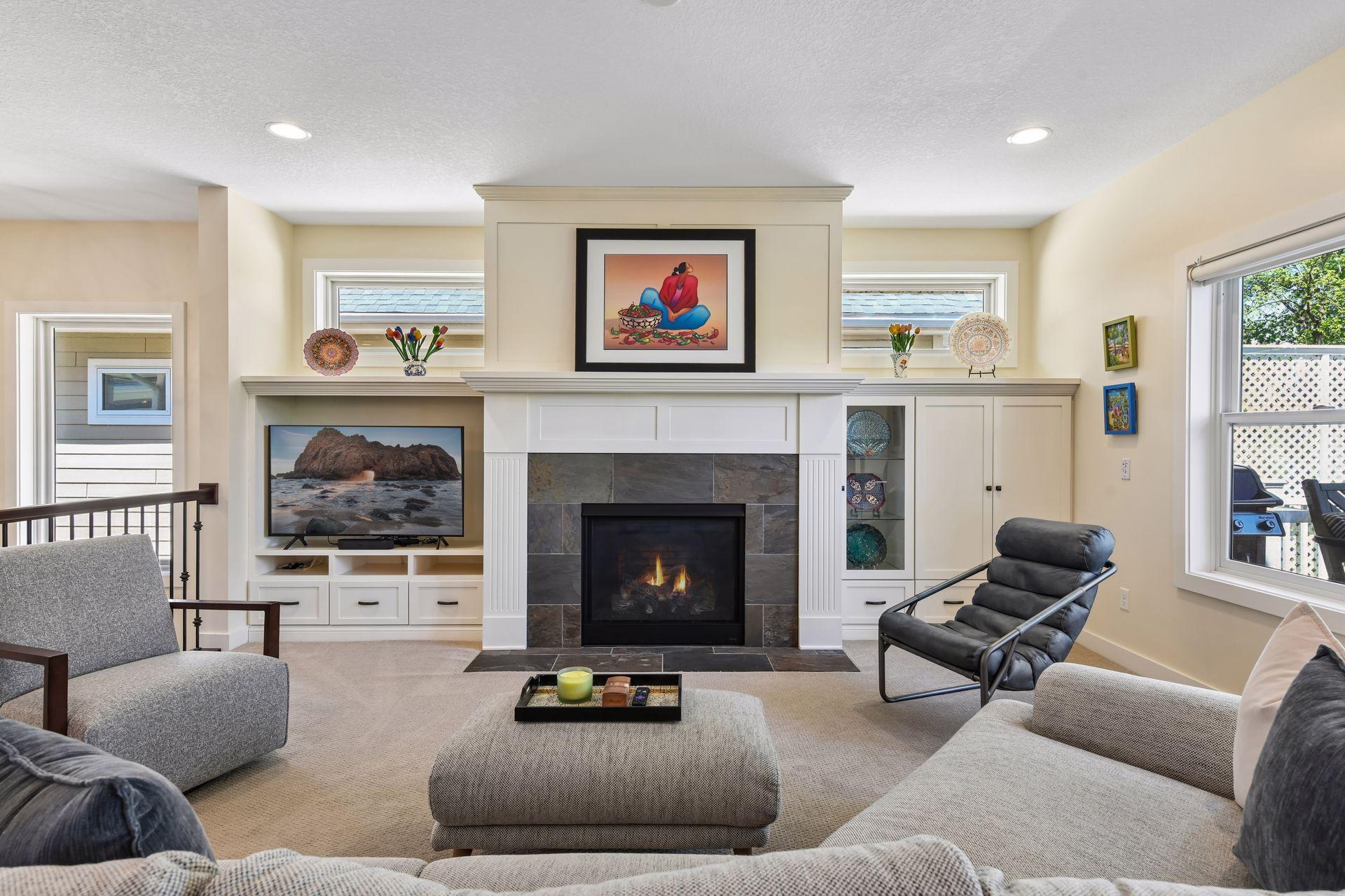 A beautiful gas fireplace surrounded by stone tile anchors the main floor great room. Storage is an added feature.