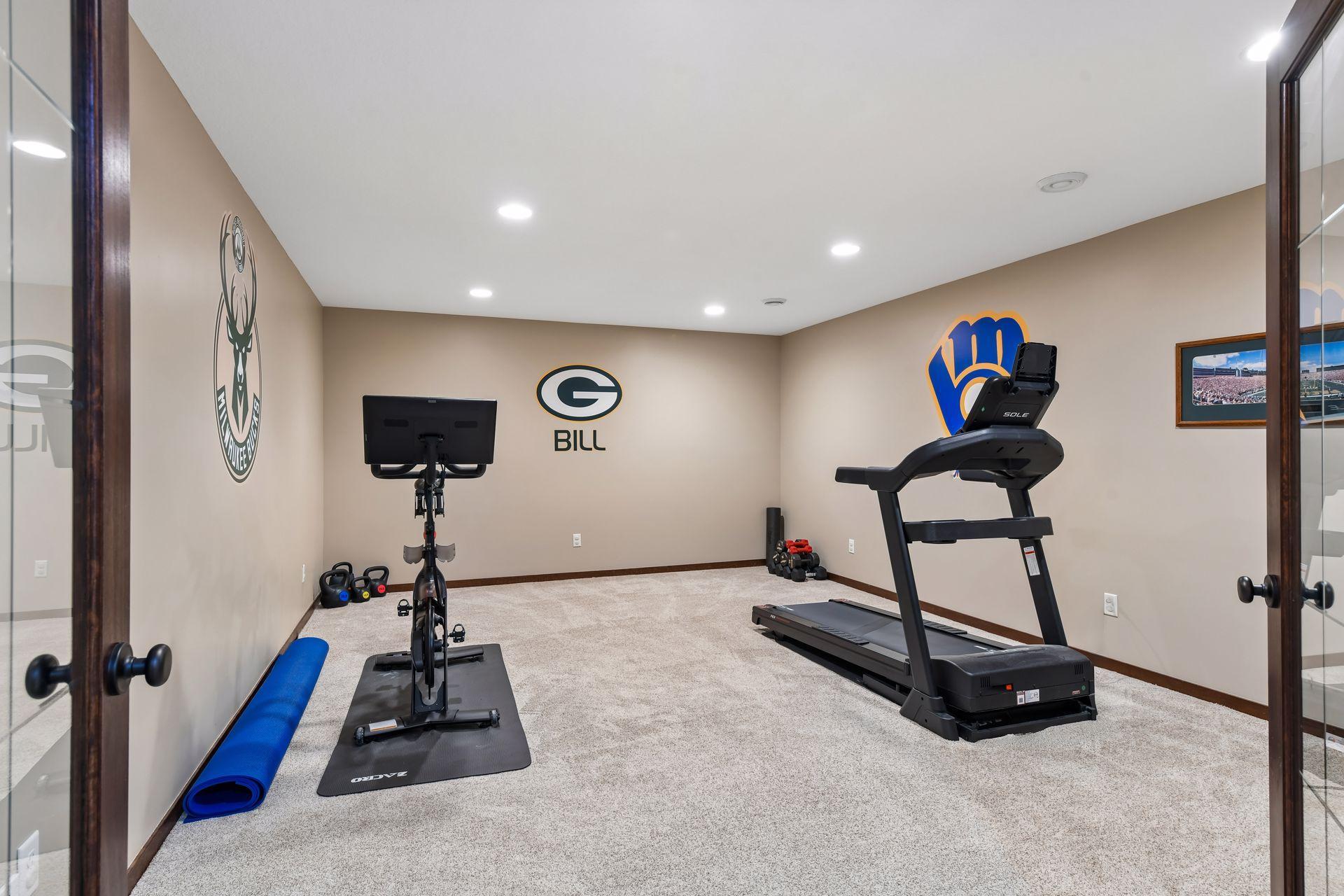 Also located on the lower level, through French doors, is a multi-purpose space that could be used as a theater room, exercise area (as shown), craft room or more.