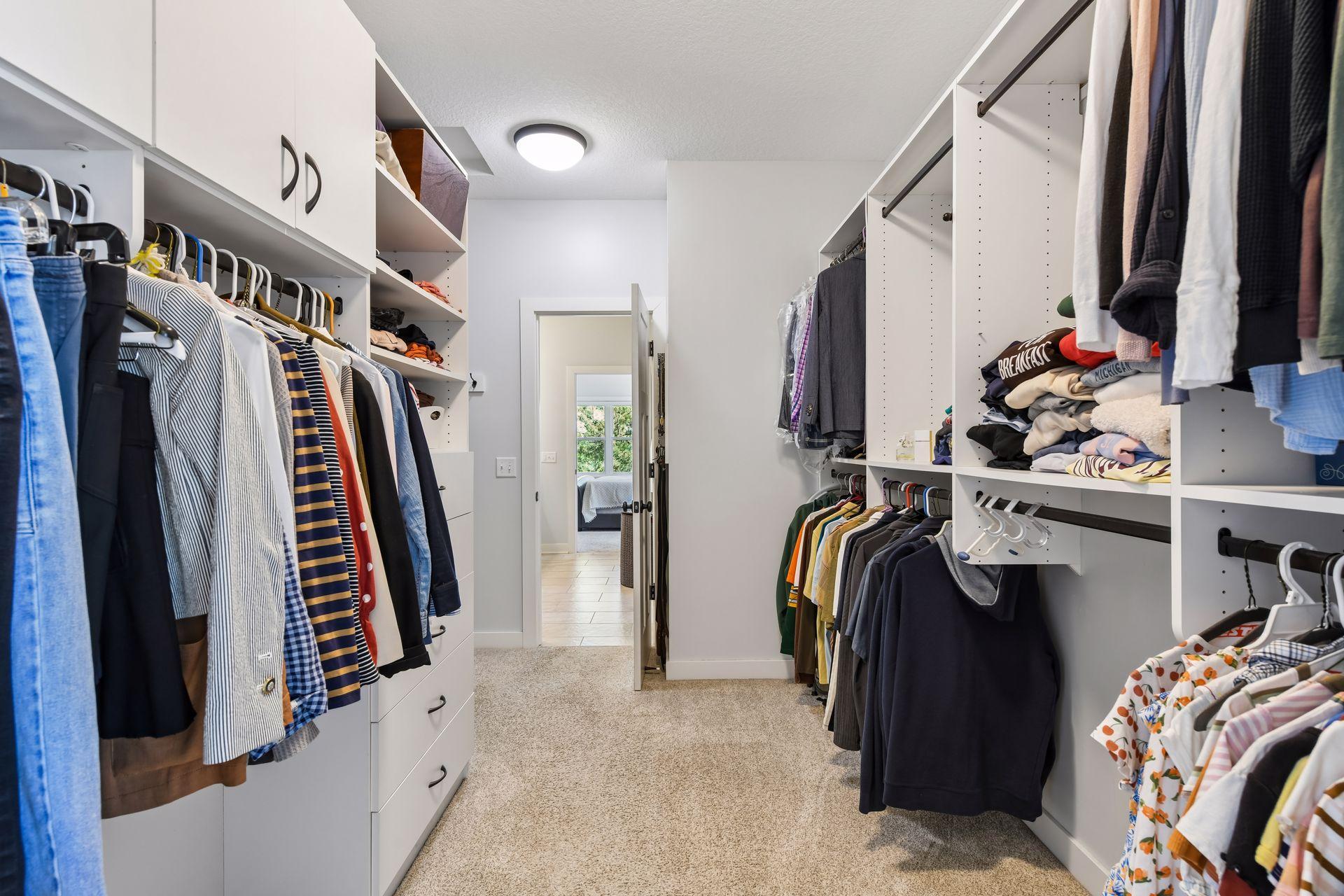From the primary bathroom en suite you can walk straight into the homeowner's walk-in closet, which is larger than pictured, and features many built-in's for shoes and jewelry (not shown), and storage.
