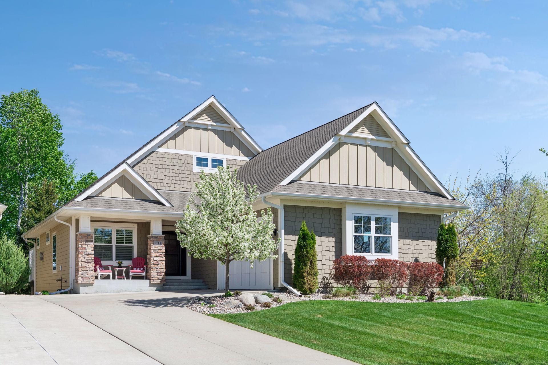 This terrific executive villa features a main floor primary bedroom suite and views of nature