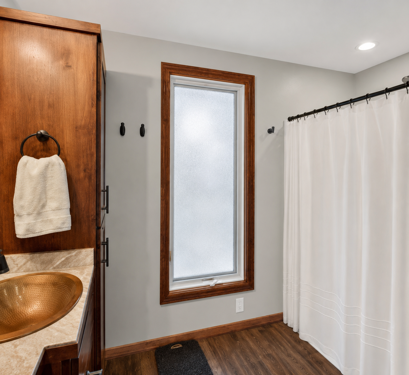 Updated Private Primary 3/4 Bath with copper bowl sink accents