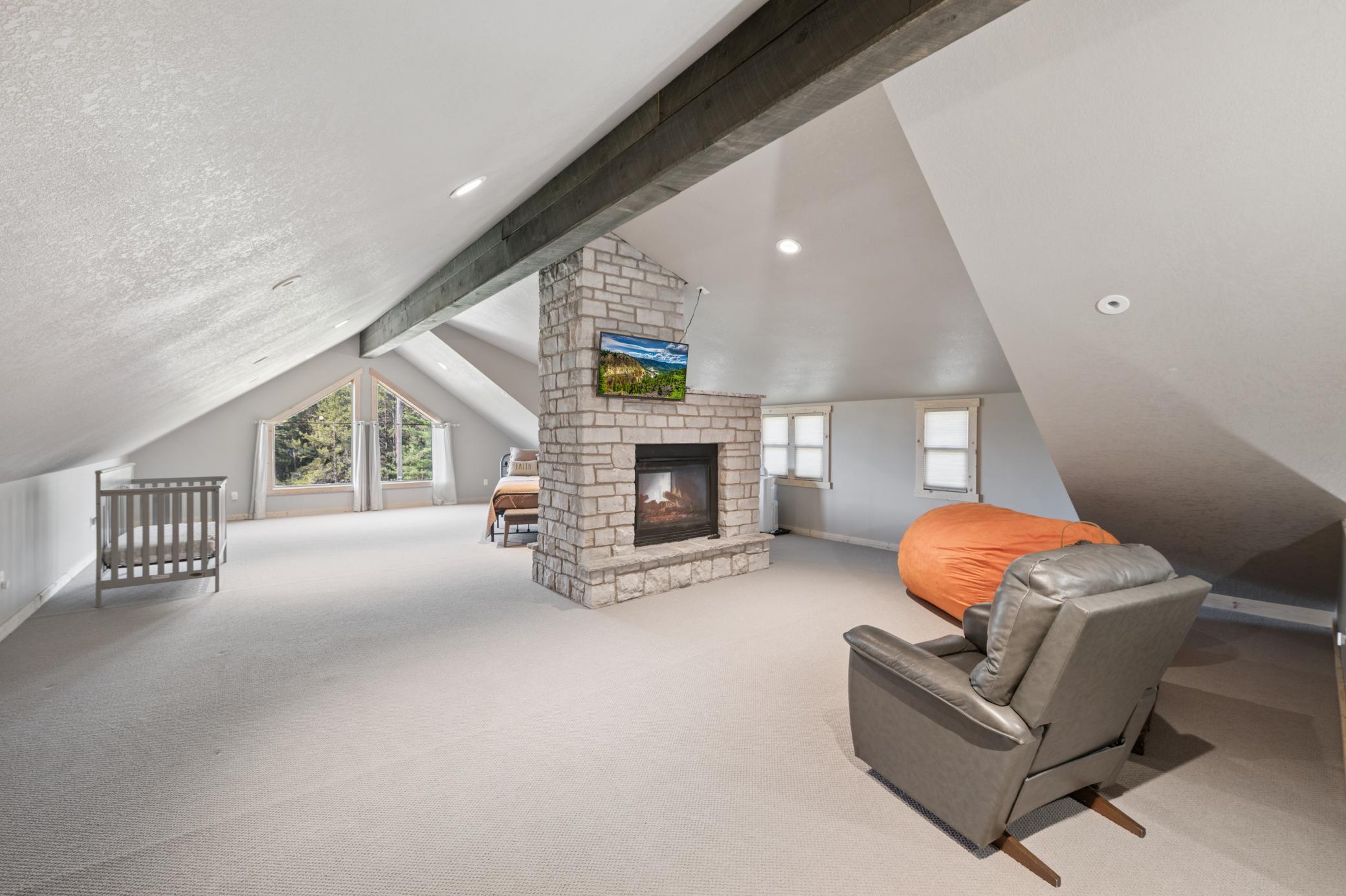 Loft with Stone Fireplace