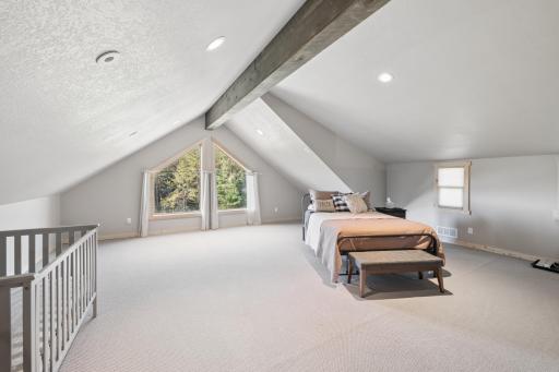 Loft has exposed stained ceiling beam