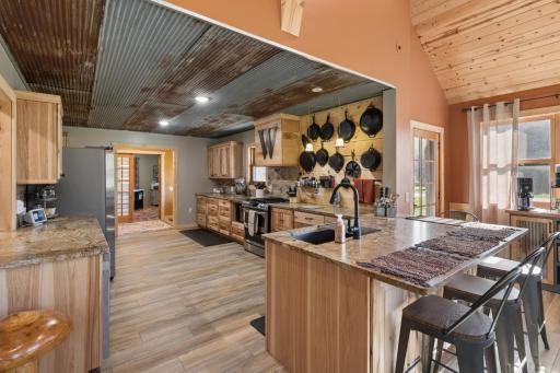 Large open kitchen design also features peninsula seating and atrium door out to the front porch!