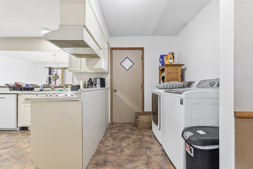 Dedicated laundry space off the main living/kitchen area.