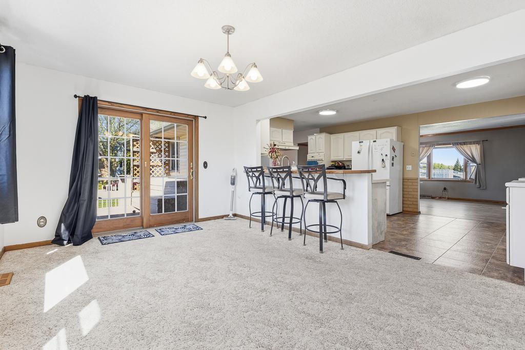 Really wonderful dining space that opens to kitchen island and out to back deck/fenced in yard.
