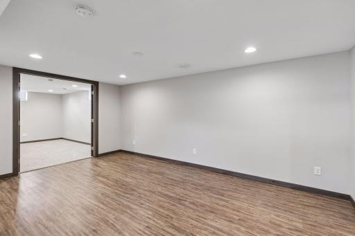 This versatile open space adjacent to the family room would be a great place for a pool table, hobbies and crafts, or a fitness area.