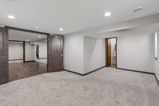 Inside the fourth bedroom, you can see just how spacious and bright it is with another egress window. The attached bathroom is a three-quarter bath and is ready for your updates.