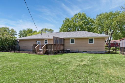 New roof in 2024. The deck is a decent size and has a privacy screen. There is a second gate on the side of the home that leads to the backyard.