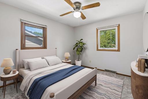 The second bedroom looks out to the side and the backyard and gets great natural sunlight.