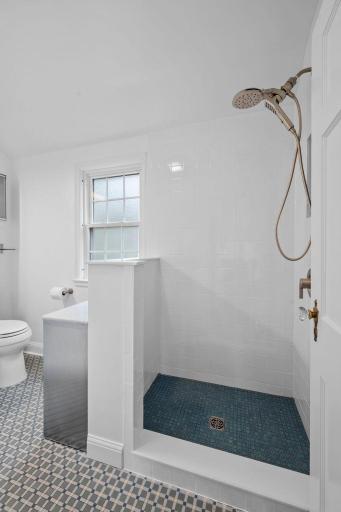 A new glass shower surround will be installed soon.
