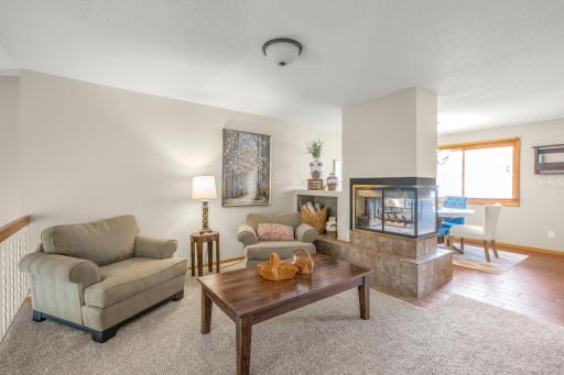 Double sided fireplace between family and dining room!