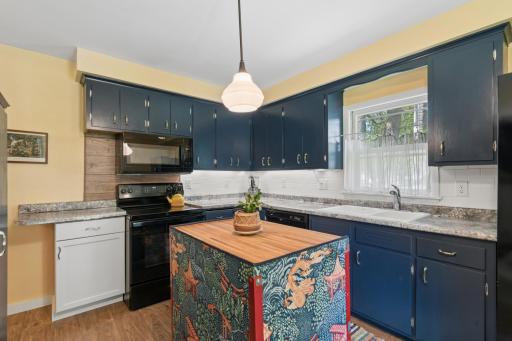 The removable center island was crafted from a tool cabinet left at the home.