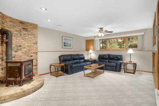 Lower level family room with electric stove fireplace