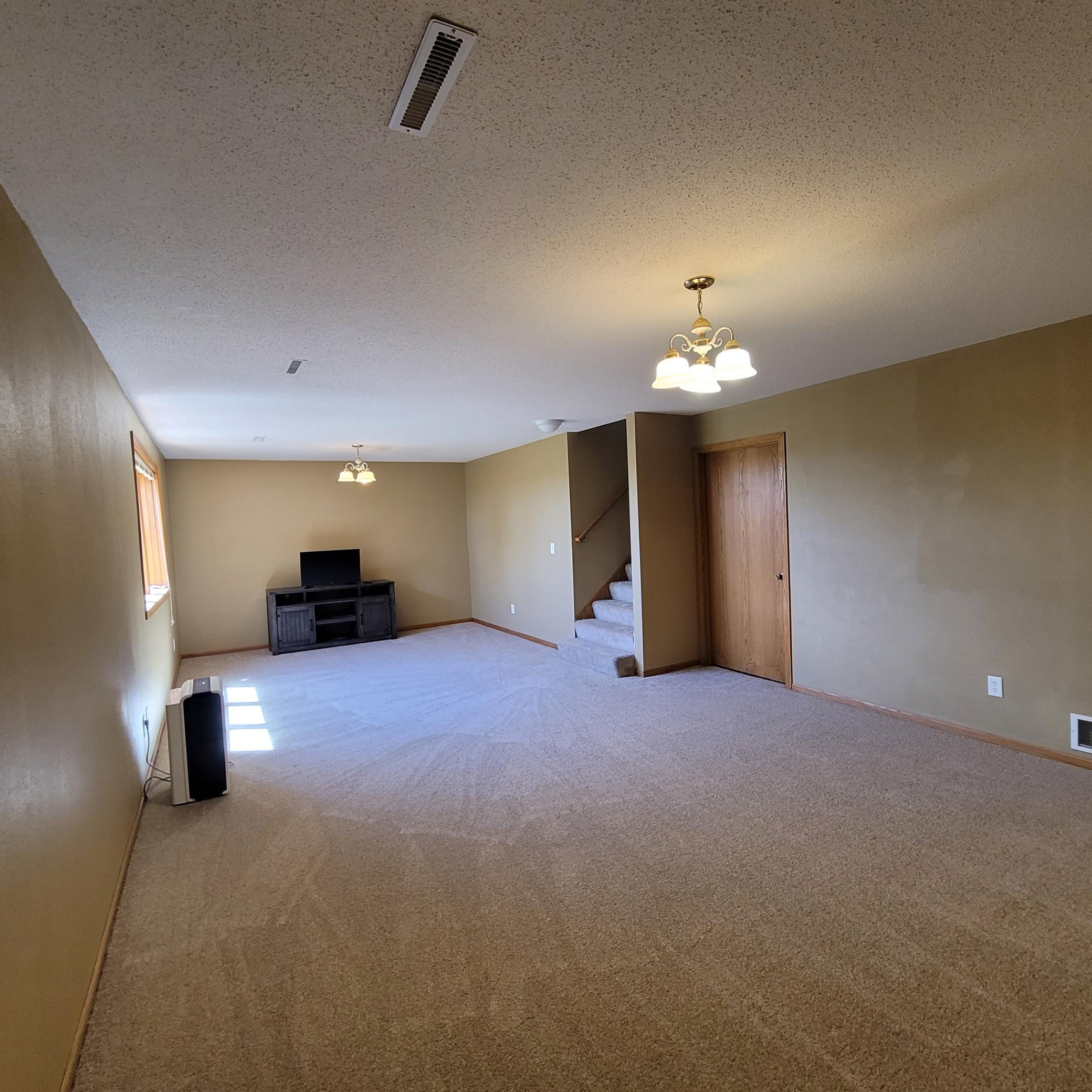 Lower Level Entertainment Room (View 1)