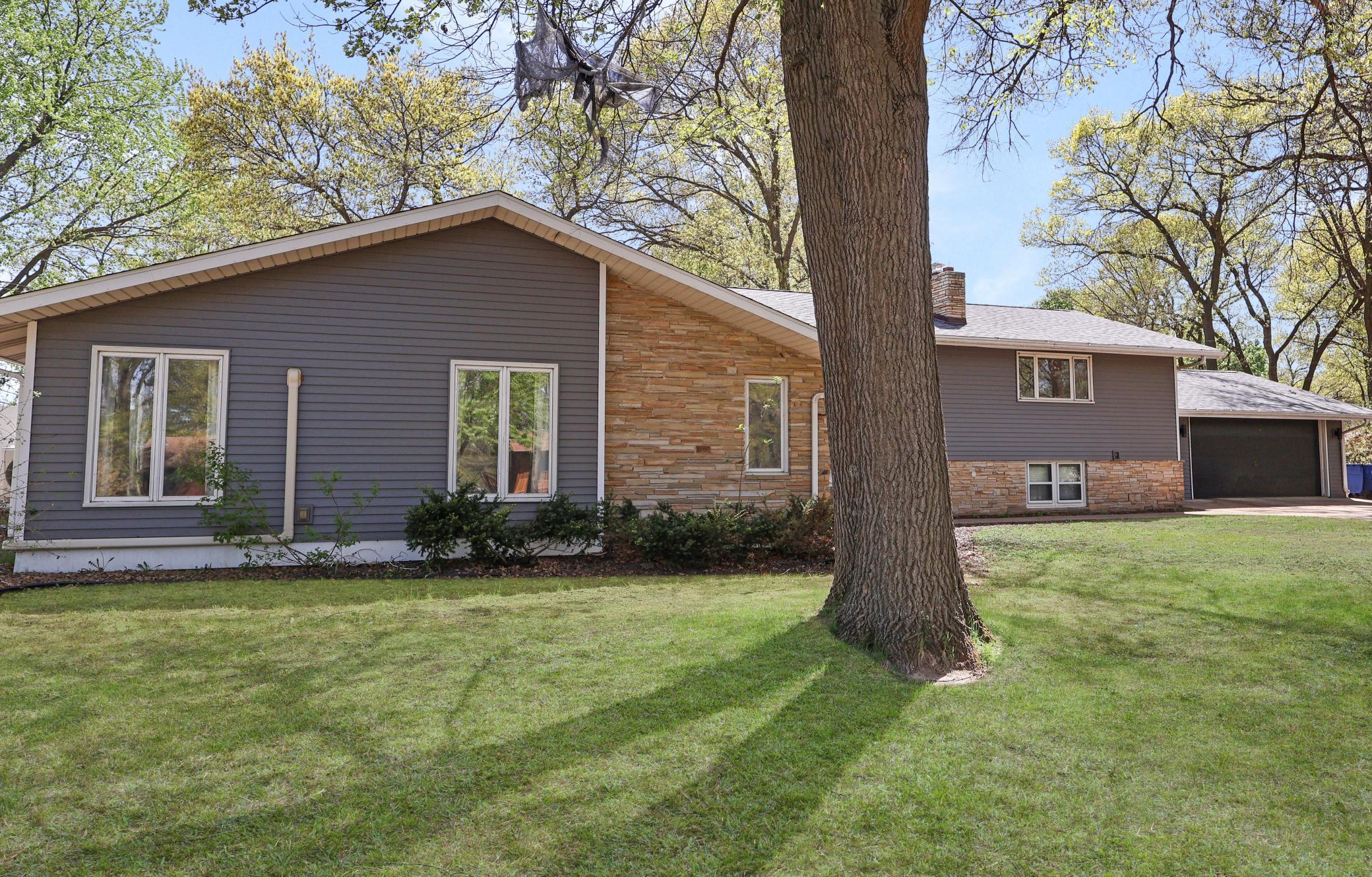 Front of home with new steel siding and new roof.