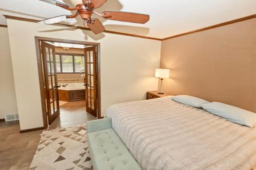 Primary bedroom to private bathroom view.