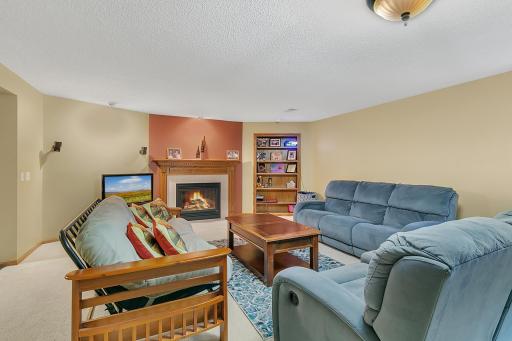 Lower level family room with built in fireplace.