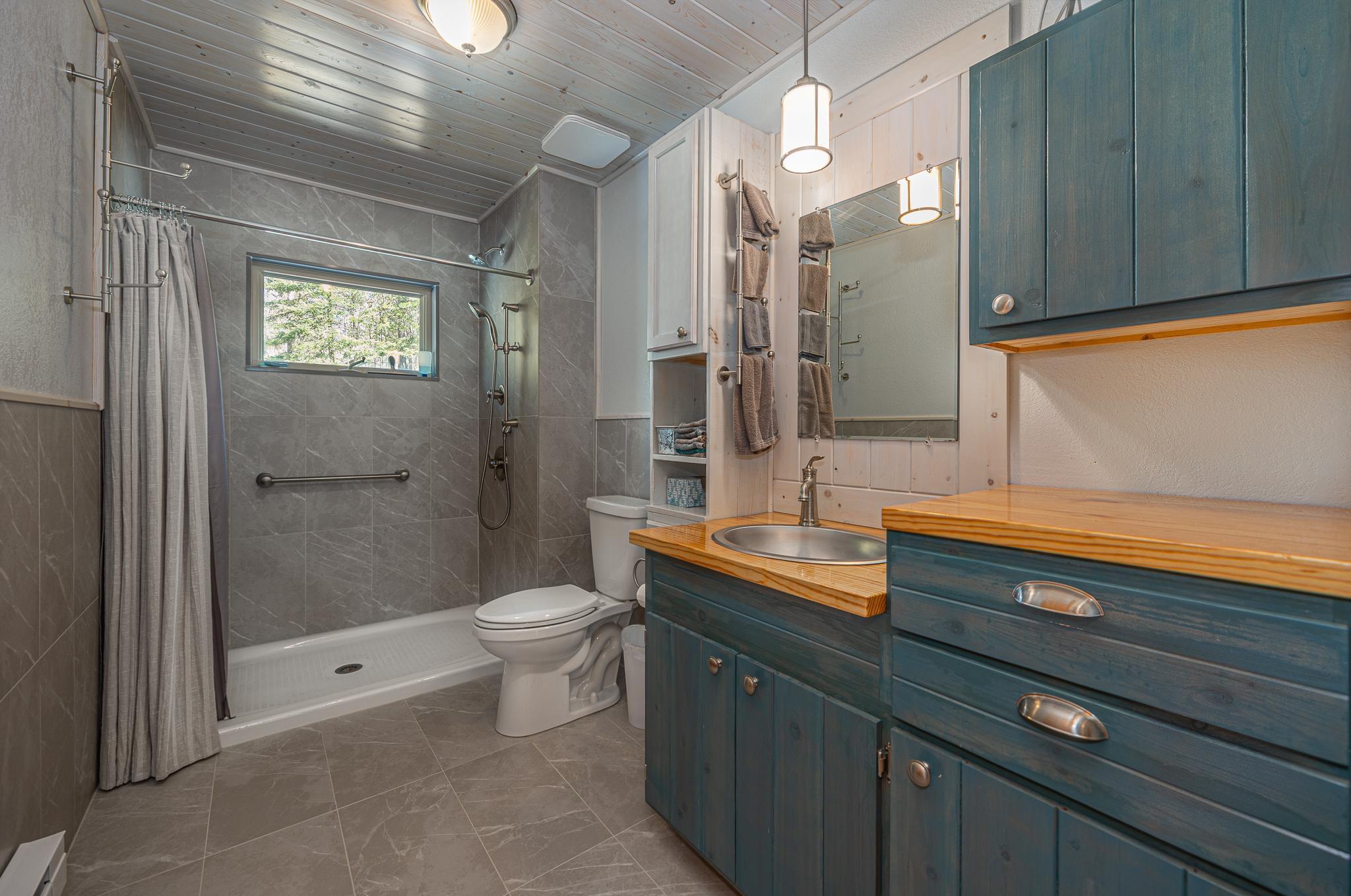 Bathroom with large tile shower