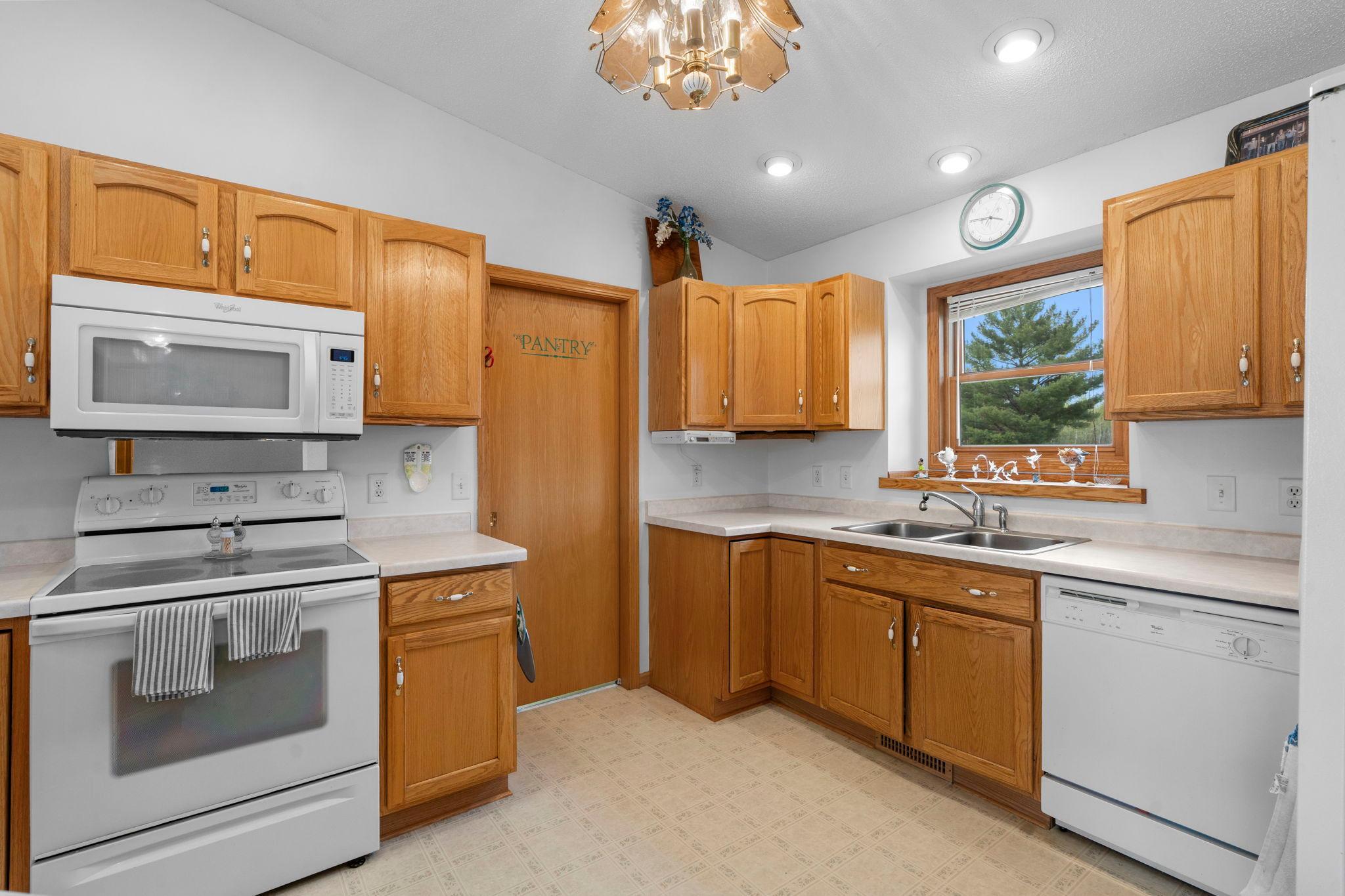 Kitchen has a walk-in storage pantry