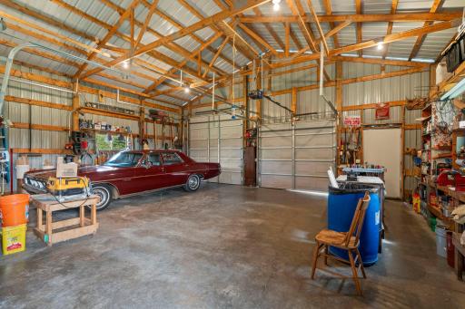 3 overhead garage doors, one with operator