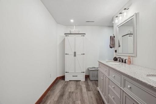 LL Bathroom shows off nice flooring and modern bright lighting.