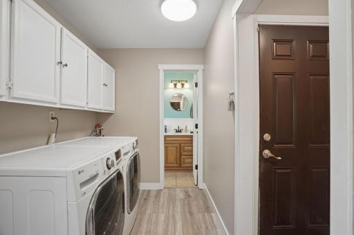 Tucked away 1/2 bath and an access to the garage adds convenience for every day living.