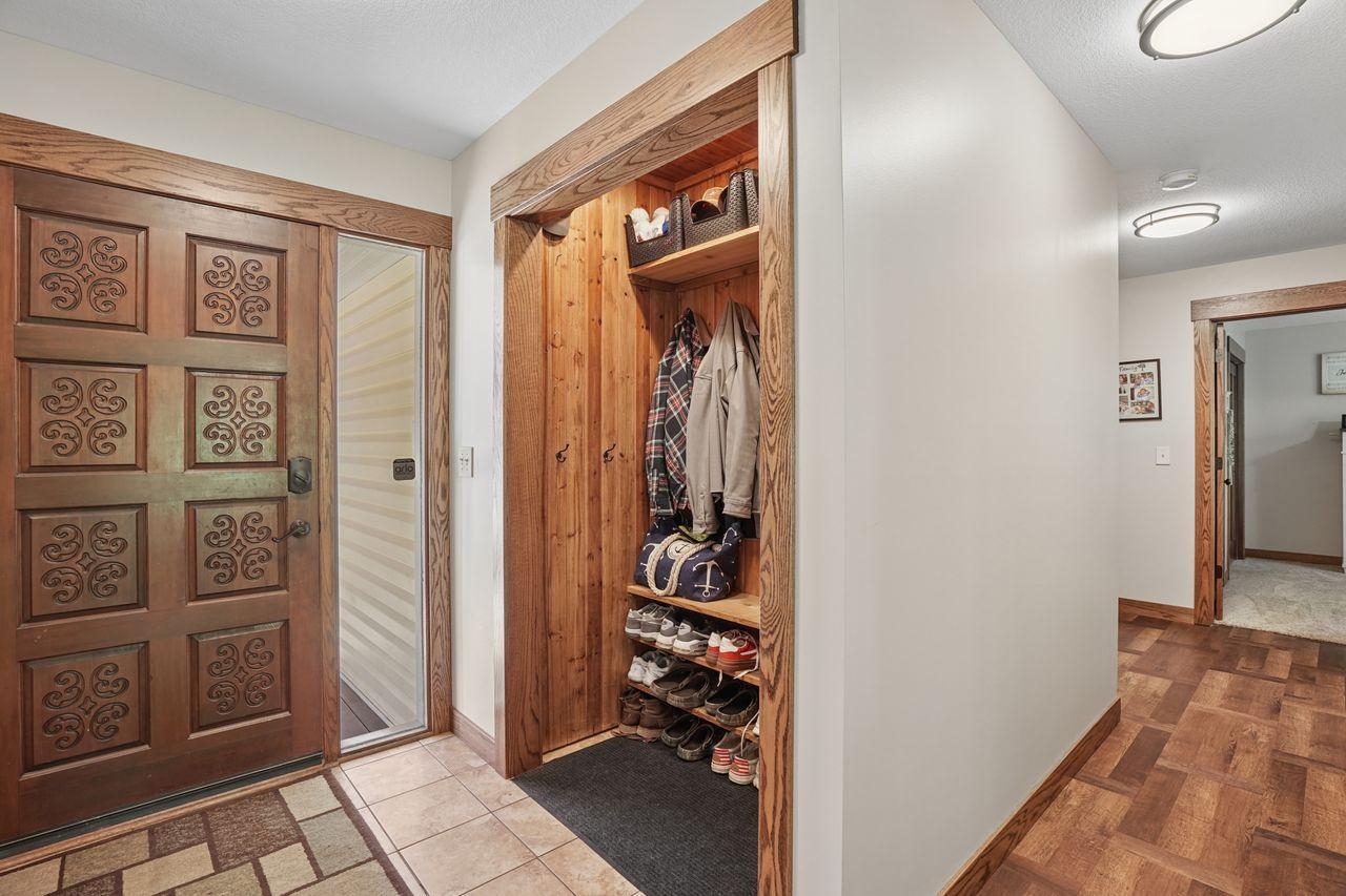 Elegant finishes shine throughout the home with a sophisticated blend of rich multi-tone hardwood flooring and upscale tilework, creating warmth, texture, and timeless luxury.