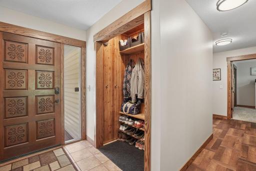 Elegant finishes shine throughout the home with a sophisticated blend of rich multi-tone hardwood flooring and upscale tilework, creating warmth, texture, and timeless luxury.
