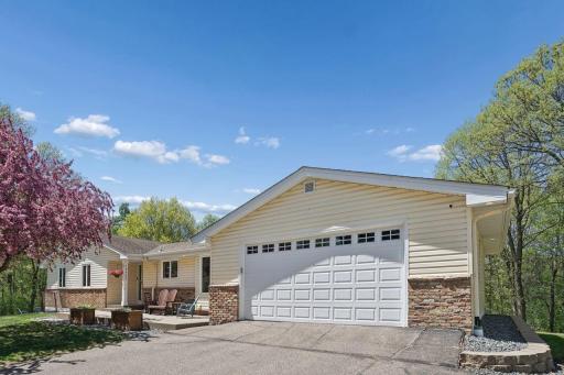 Stunning and beautifully maintained 5BR/4BA rambler nestled on a serene, heavily wooded 5-acre setting