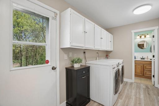 Main level laundry with a convenient door to the pool area.