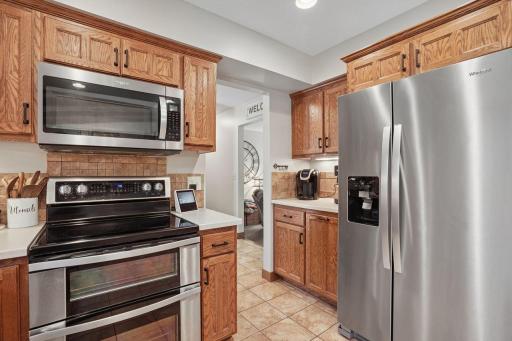 Updated stainless steel appliances and a charming designated coffee nook creates the perfect morning retreat, offering a stylish and functional space for beverages or small appliances.