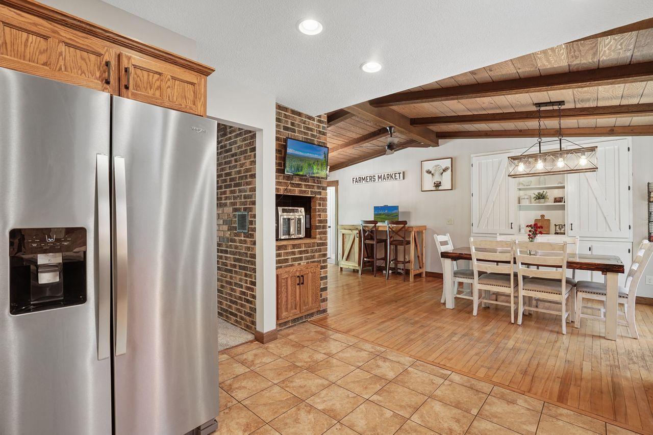 Beautifully designed kitchen positioned at the heart of the home, seamlessly opening to both the inviting sitting room and expansive dining room for effortless entertaining and everyday living