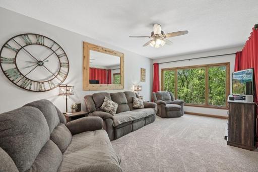 You will LOVE this living room, filled with natural light and designed for both comfortable everyday living and effortless entertaining. The views out the triple window are picture perfect.