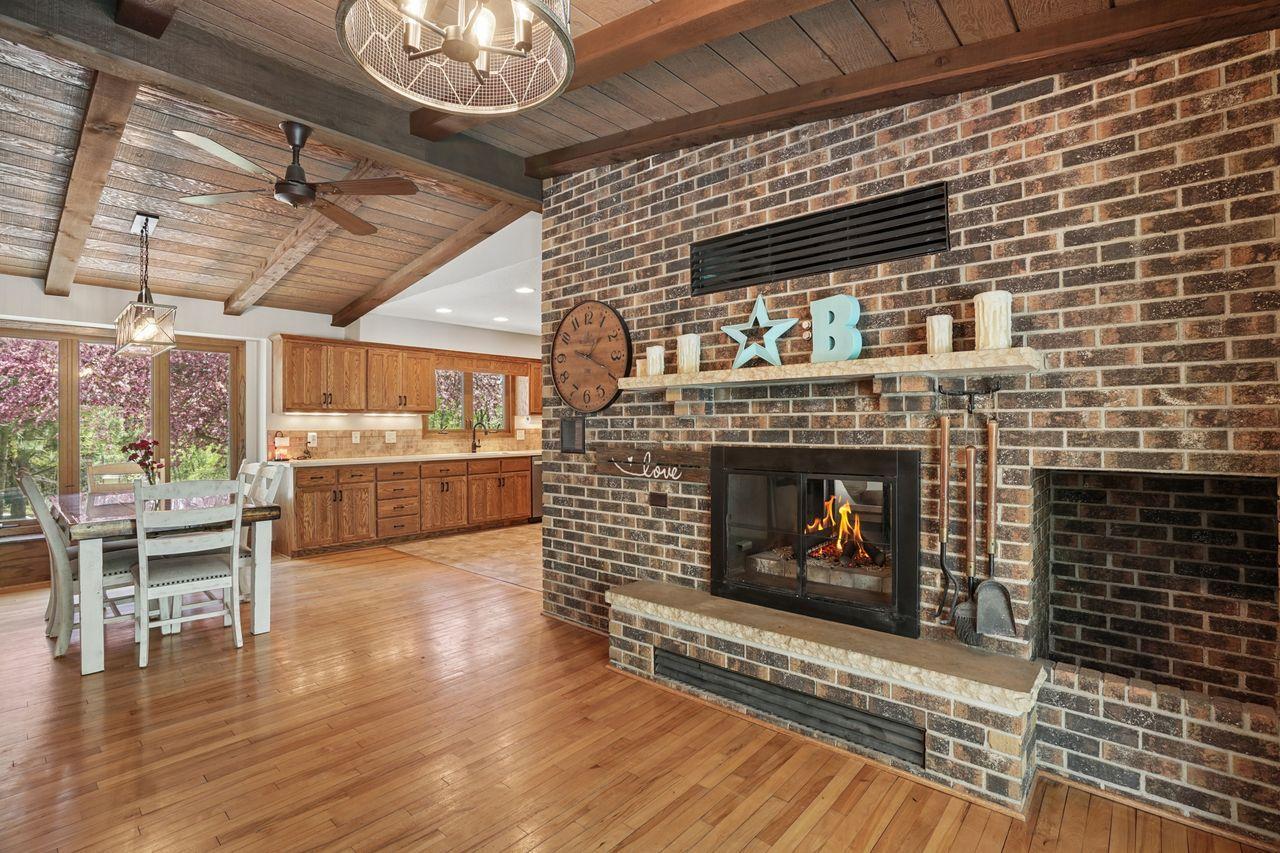 Double sided fireplace also opens to dining room. Fire is for staging purposes only. Just imagine decorating and entertaining for the Holidays.