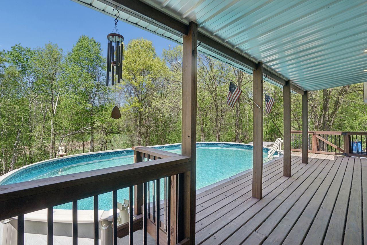 Walk-out the dining room to a huge deck and above ground pool, plenty of room for large pool parties.