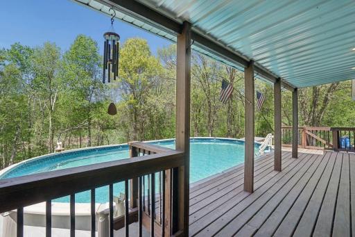 Walk-out the dining room to a huge deck and above ground pool, plenty of room for large pool parties.