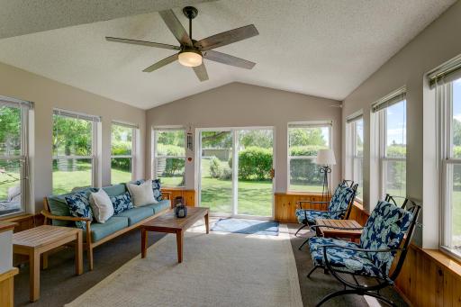 Large 3-season porch with sliding door to side yard