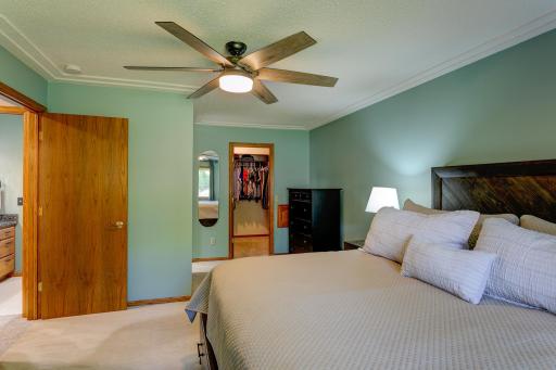 Primary bedroom with walk-in closet and access to main bath