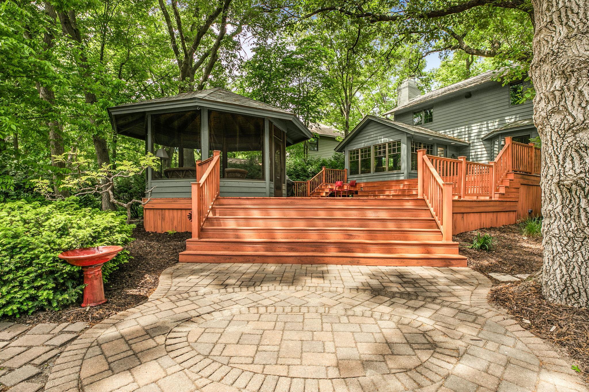 Custom paver patio provides a functional space for relaxing and gatherings.
