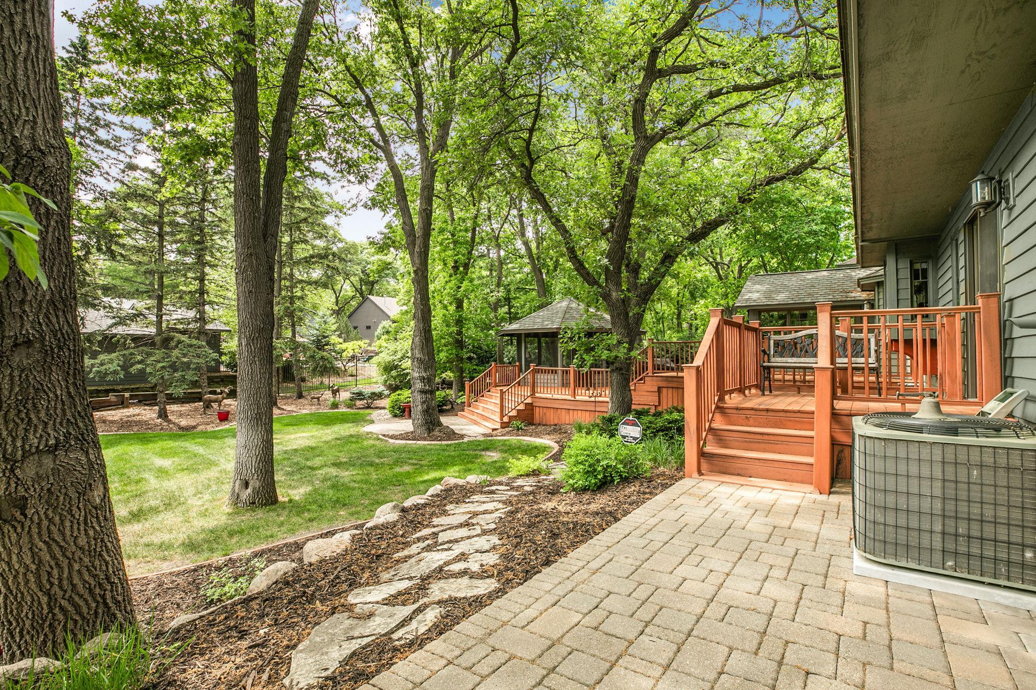 Mature trees provide shade, privacy, and timeless natural beauty.