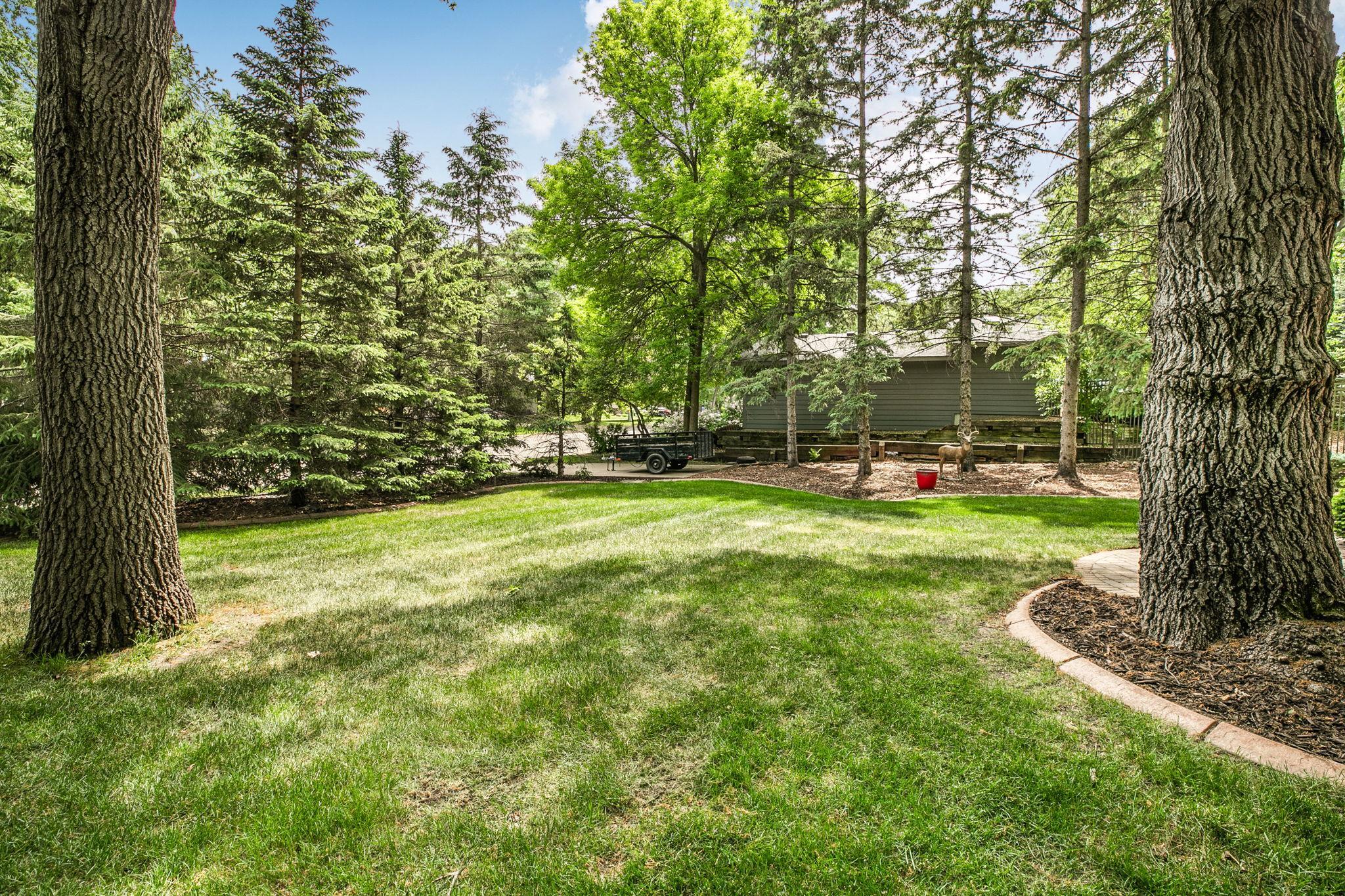 Beautifully landscaped yard enhances the home&rsquo;s curb appeal.