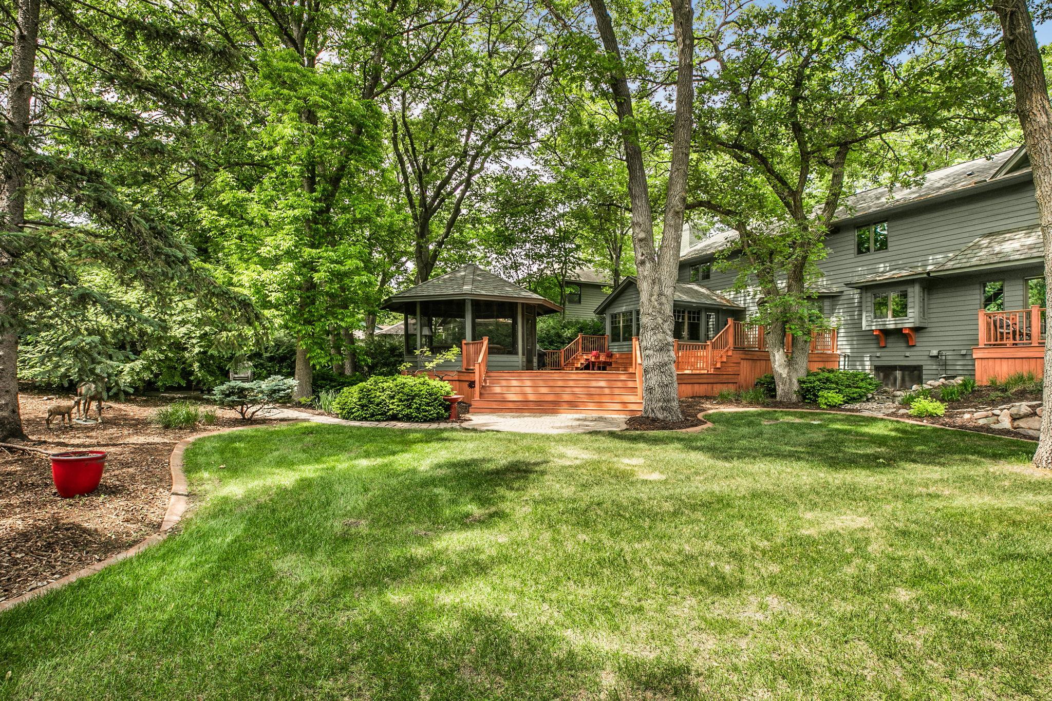 Backyard perspective captures the home&rsquo;s exterior and outdoor layout.