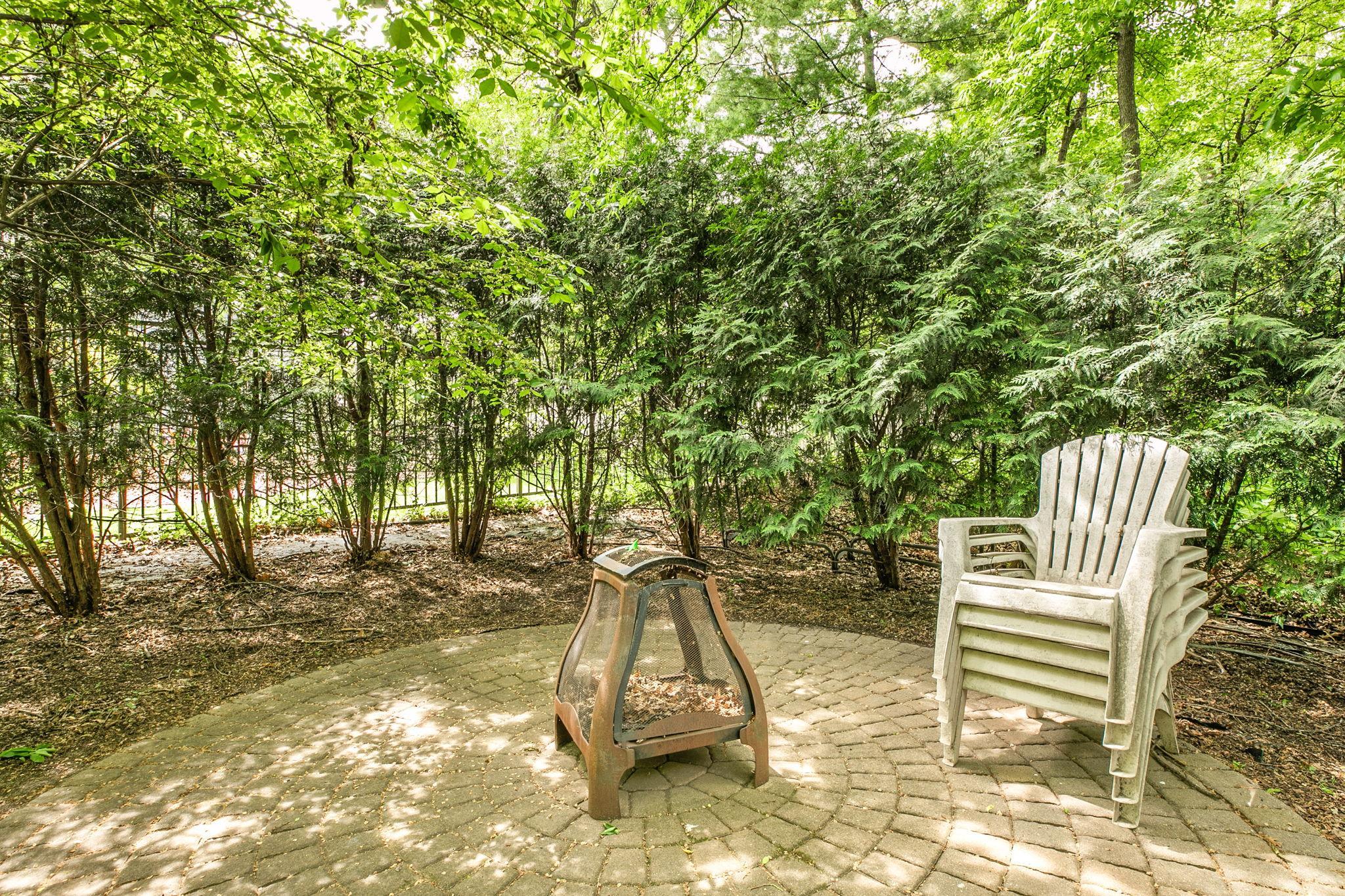 Beautiful paver patio creates a warm space for firepit gatherings.