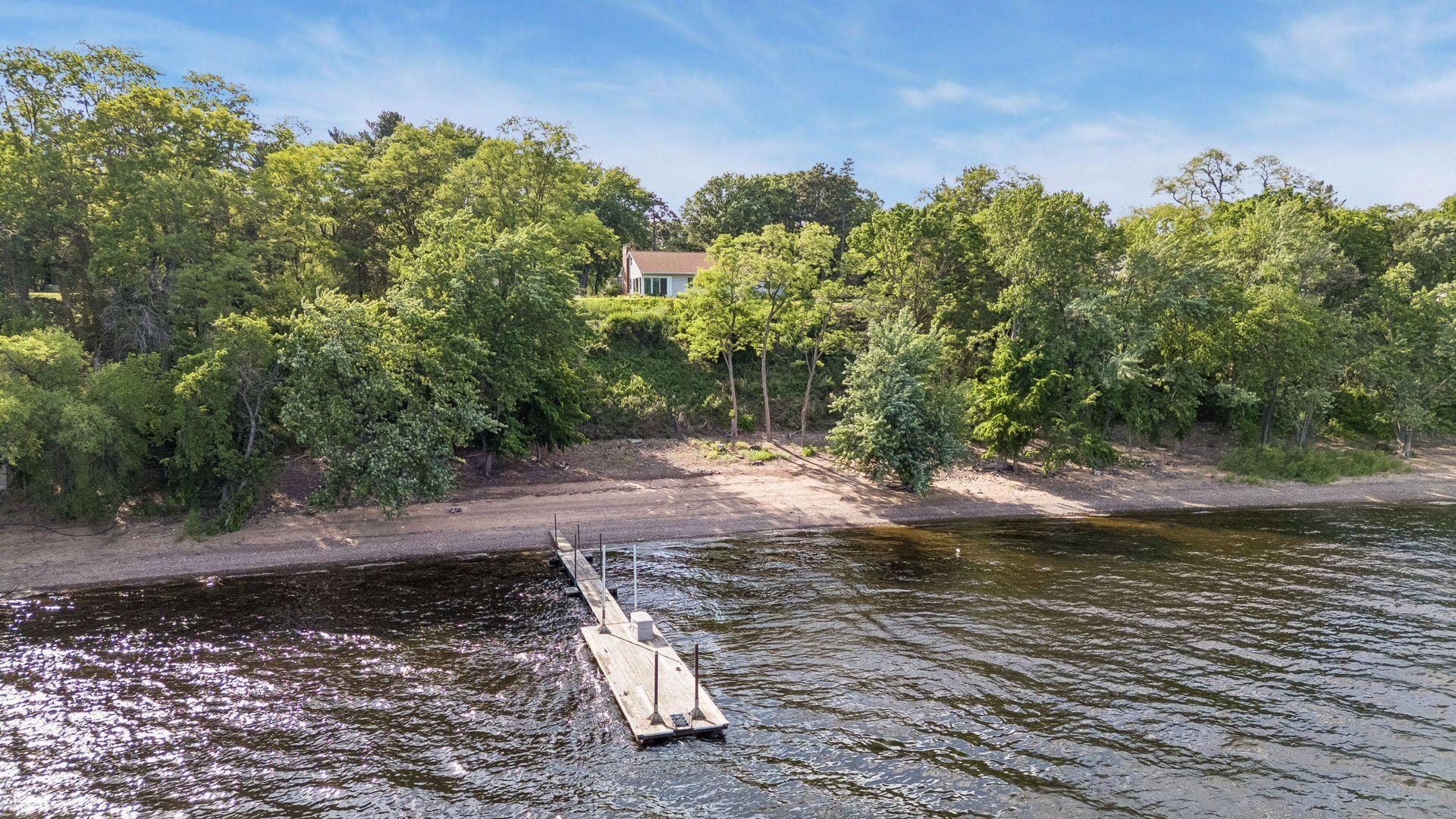 Welcome to 145 Lakeland Shores Rd on the St. Croix River. Enjoy approximately 250 feet of sandy beach.