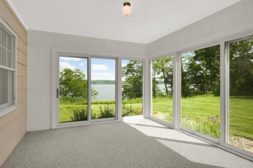 The 3-season porch offers spectacular views of the river!