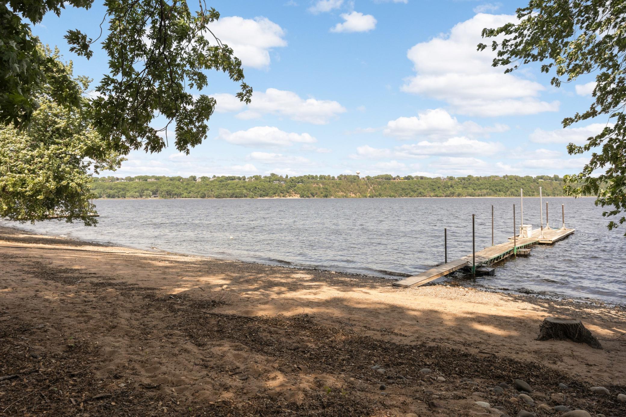 Enjoy your private sandy beach with dock all set to go for summer fun!